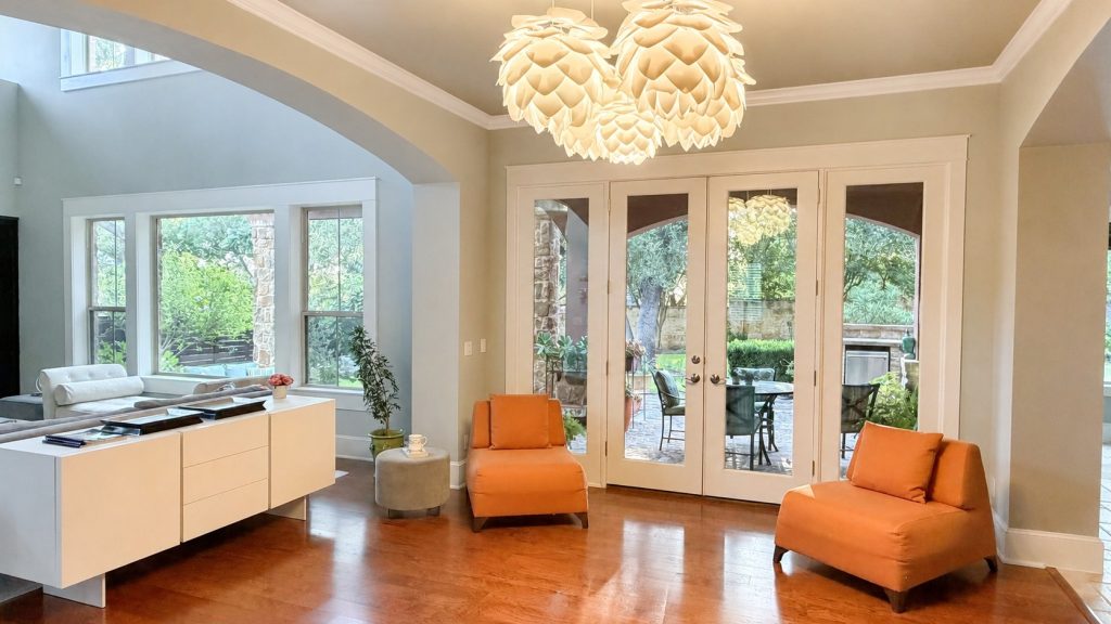 Gleaming wood floors with French doors to al fresco dining.