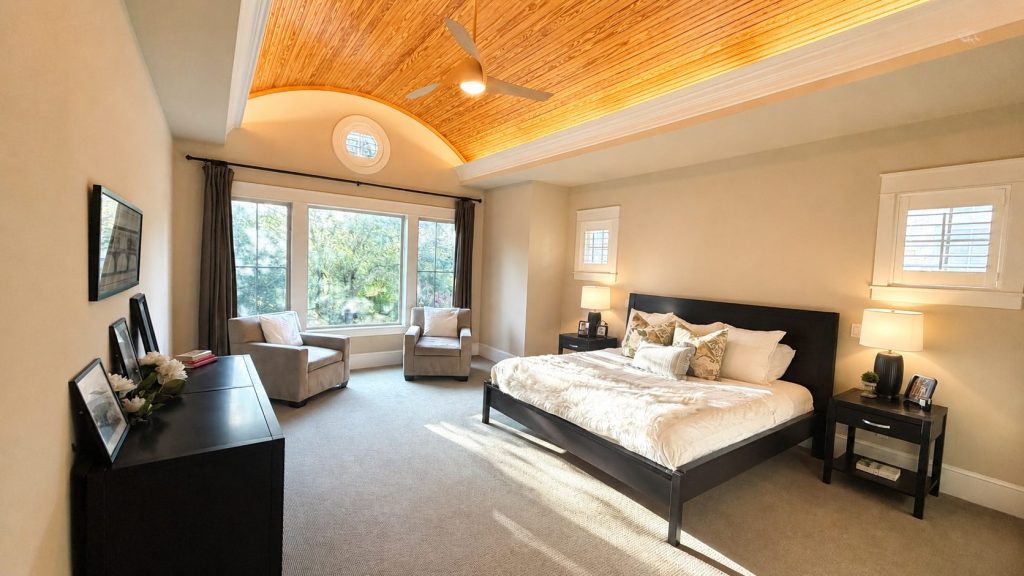 Primary Suite is flooded with afternoon sunlight. Barrel ceiling creates a warm ambiance.